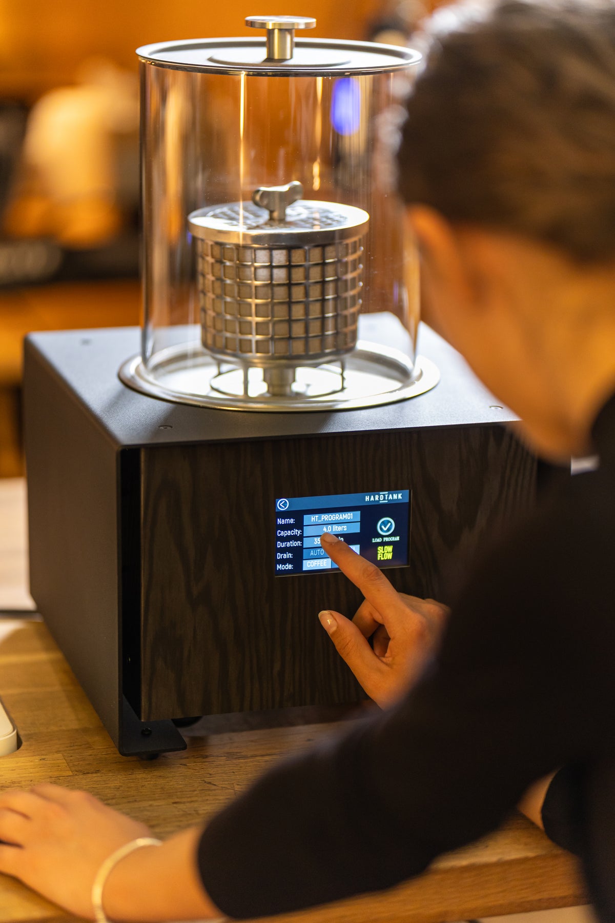 Barista starting a cold brew batch on the Baby Hardtank touchscreen